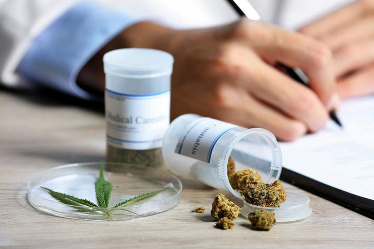 medical cannabis containers in Texas next to a doctor’s hands