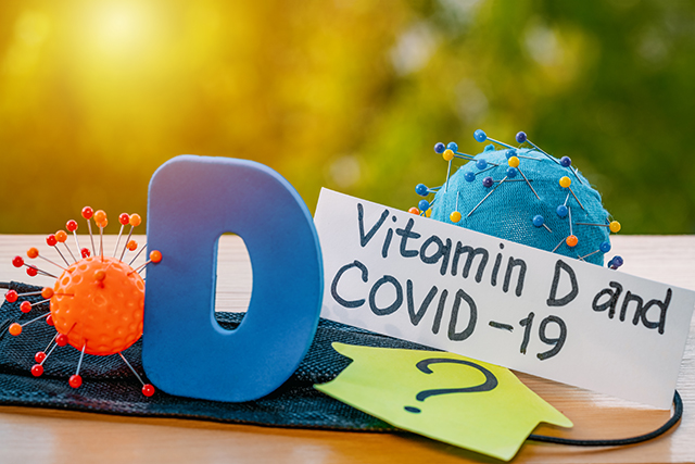 Vitamin D helps in treating coronavirus. Vitamin D, coronavirus, and question mark on a background of sunlight.