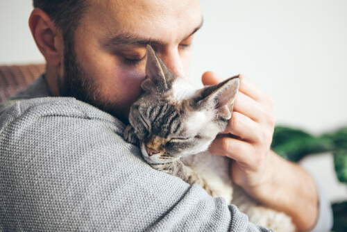 Young man with emotional support cat