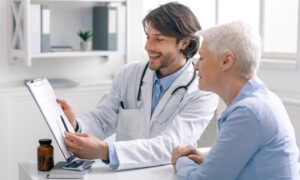 Doctor with patient smiling