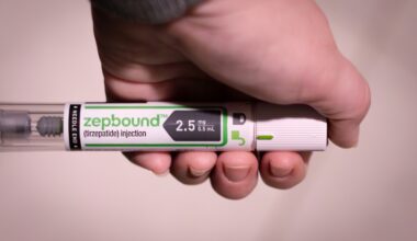 Someone holding a Zepbound injection pen