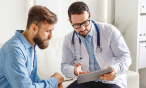 Doctor and patient speaking at appointment