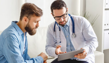 Doctor and patient speaking at appointment