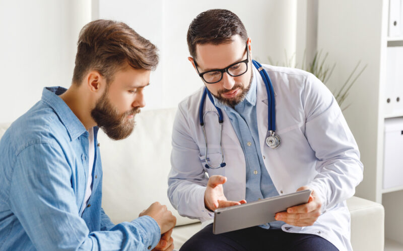 Doctor and patient speaking at appointment