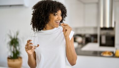 Young happy adult taking a hormone pill