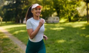 Happy young woman on a run