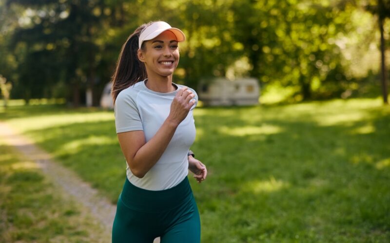 Happy young woman on a run