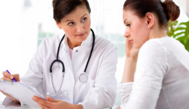 Doctor having a consultation with a young woman