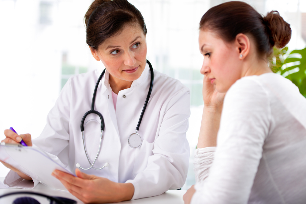 Doctor having a consultation with a young woman