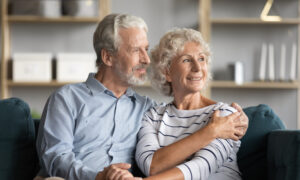 Happy older couple sitting together