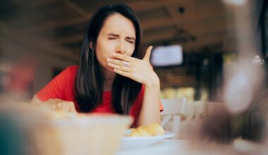 Woman feeling sick after eating food at restaurant