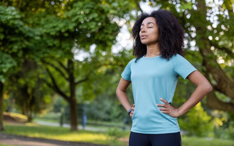 Woman practicing mental clarity in a park