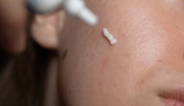 Close up of woman applying prescription cream to face