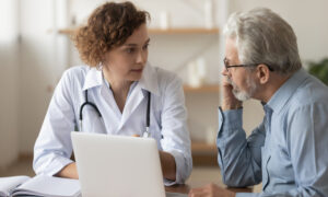 A doctor and older patient having a consultation