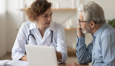 A doctor and older patient having a consultation