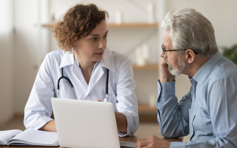 A doctor and older patient having a consultation