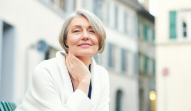 Close up outdoor photo of older woman with radiant skin
