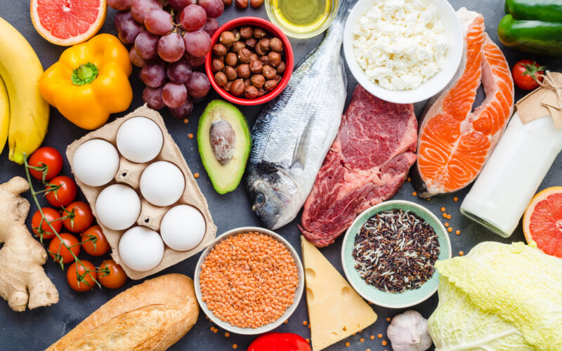 close up of healthy and nutritious foods laid out along a table