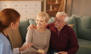 Nurse explaining husband and wife dosage for their medication