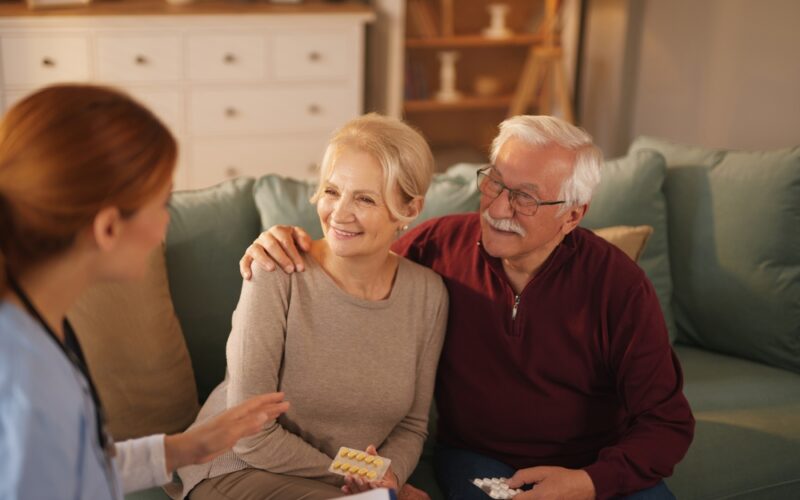 Nurse explaining husband and wife dosage for their medication