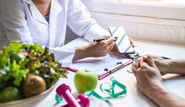 Doctor guiding patient and creating roadmap to lose weight through diet, exercise, and medication