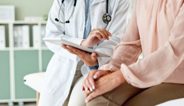 Pharmacist explaining medication to a patient while holding a prescription bottle, providing guidance on dosage and discussing liraglutide cost.
