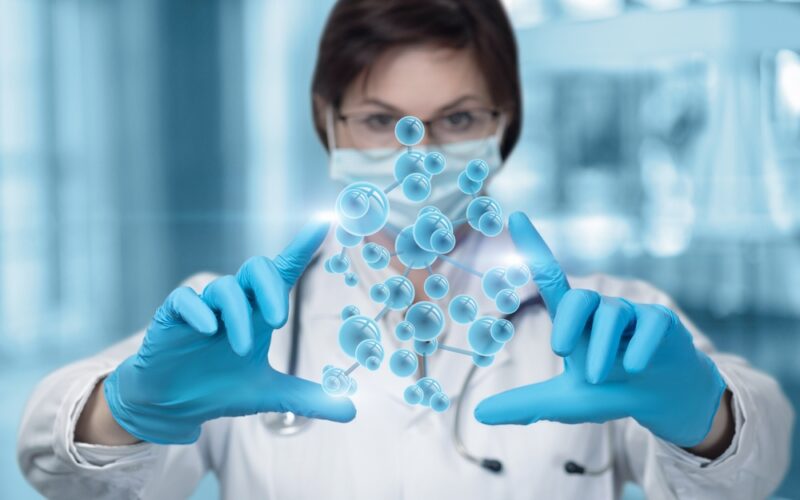 researcher scientist female visualizing hormone molcule with her hands