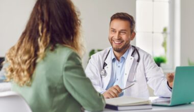 Smiling doctor consulting with a patient in his office, discussing treatment options and explaining the liraglutide maximum dose.