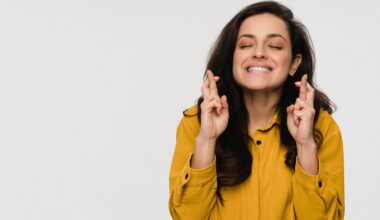 Liraglutide Hopeful happy young business woman female student crossing fingers hoping for good luck, making wish asking dream come true isolated on white studio background, superstition beliefs