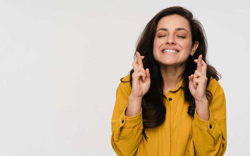 Liraglutide Hopeful happy young business woman female student crossing fingers hoping for good luck, making wish asking dream come true isolated on white studio background, superstition beliefs