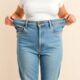 Woman weight loss with too big pants