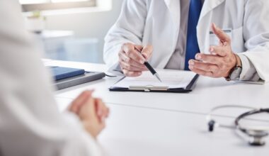 Doctor reviewing medical notes with a patient, discussing whether liraglutide and semaglutide can be taken together safely.