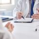 Doctor reviewing medical notes with a patient, discussing whether liraglutide and semaglutide can be taken together safely.