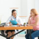 Doctor reviewing treatment notes with a patient during consultation, explaining the similarities and differences of liraglutide and Ozempic.