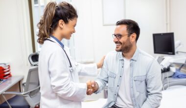 Wegovy smiling young female doctor shake hand close health insurance deal with elderly patient at consultation in hospital. Happy woman GP handshake greeting get acquainted with man in clinic.