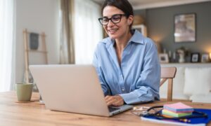Heally Telemedicine. Young woman doctor working at home office, private general practitioner, healthcare and medical female worker using laptop computer for contact with senior patients Helping people online