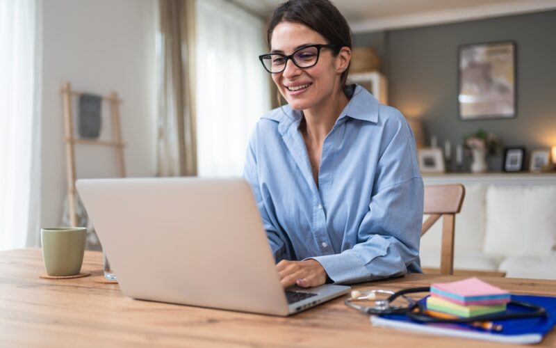 Heally Telemedicine. Young woman doctor working at home office, private general practitioner, healthcare and medical female worker using laptop computer for contact with senior patients Helping people online