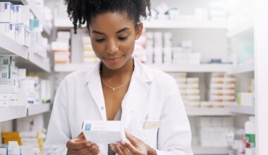 Tirzepatide Woman, pharmacist and checking box with medication, side effects or symptoms at pharmacy. Young African, female person or medical employee reading expiry date on pharmaceutical product at store