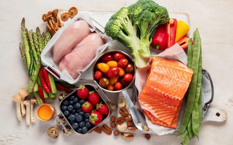 Wegovy diet food. Healthy low carbs products. Keto diet concept. Vegetables, fish, meat, nuts, seeds, berries, cheese on a white background, top view.
