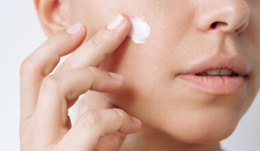 Woman applying Tretinoin into her skin to treat acne, wrinkles, and dark circles.