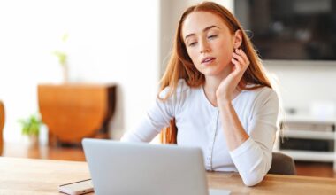 “Woman at home using a laptop, representing the convenience and accessibility of consulting a PCOS online doctor for faster diagnosis and personalized care.