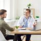 Doctor consulting with a patient in a bright medical office, representing professional guidance on combining Metformin and GLP-1 medications like semaglutide or tirzepatide for improved weight loss outcomes.