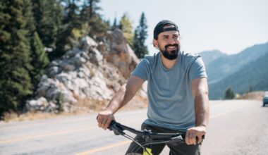 Energized man riding a bike in nature, representing the boost in energy, focus, and cellular vitality that NAD+ IV therapy may provide.