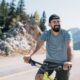 Energized man riding a bike in nature, representing the boost in energy, focus, and cellular vitality that NAD+ IV therapy may provide.