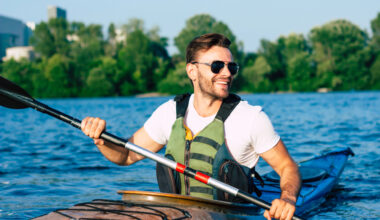 “Energetic, healthy man kayaking, representing the benefits of IV therapy for hydration, energy, and overall wellness support.
