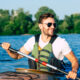 “Energetic, healthy man kayaking, representing the benefits of IV therapy for hydration, energy, and overall wellness support.
