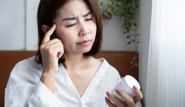 Asian woman looking at her semaglutide and thinking about how to interpret her dosing chart for semaglutide microdosing.