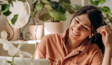 Woman enjoying increased energy and mental clarity while working on her laptop, symbolizing the lesser-known benefits of sermorelin such as improved mood, focus, and recovery.