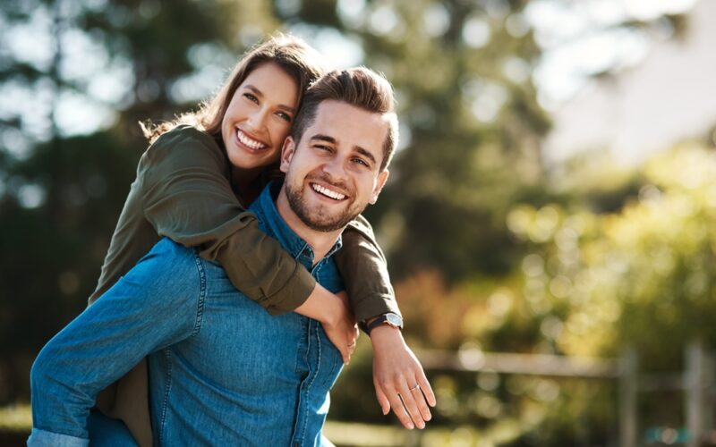 A couple in nature on semaglutide hugging each other experiencing affected sex drive as a side effect.
