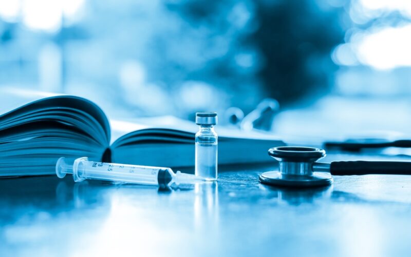 Image Of a Needle and Book Showing How to Inject a Weight Loss Pen Properly